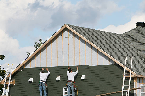 Professional Storm Damage Siding Repair technician working in Merrick, NY